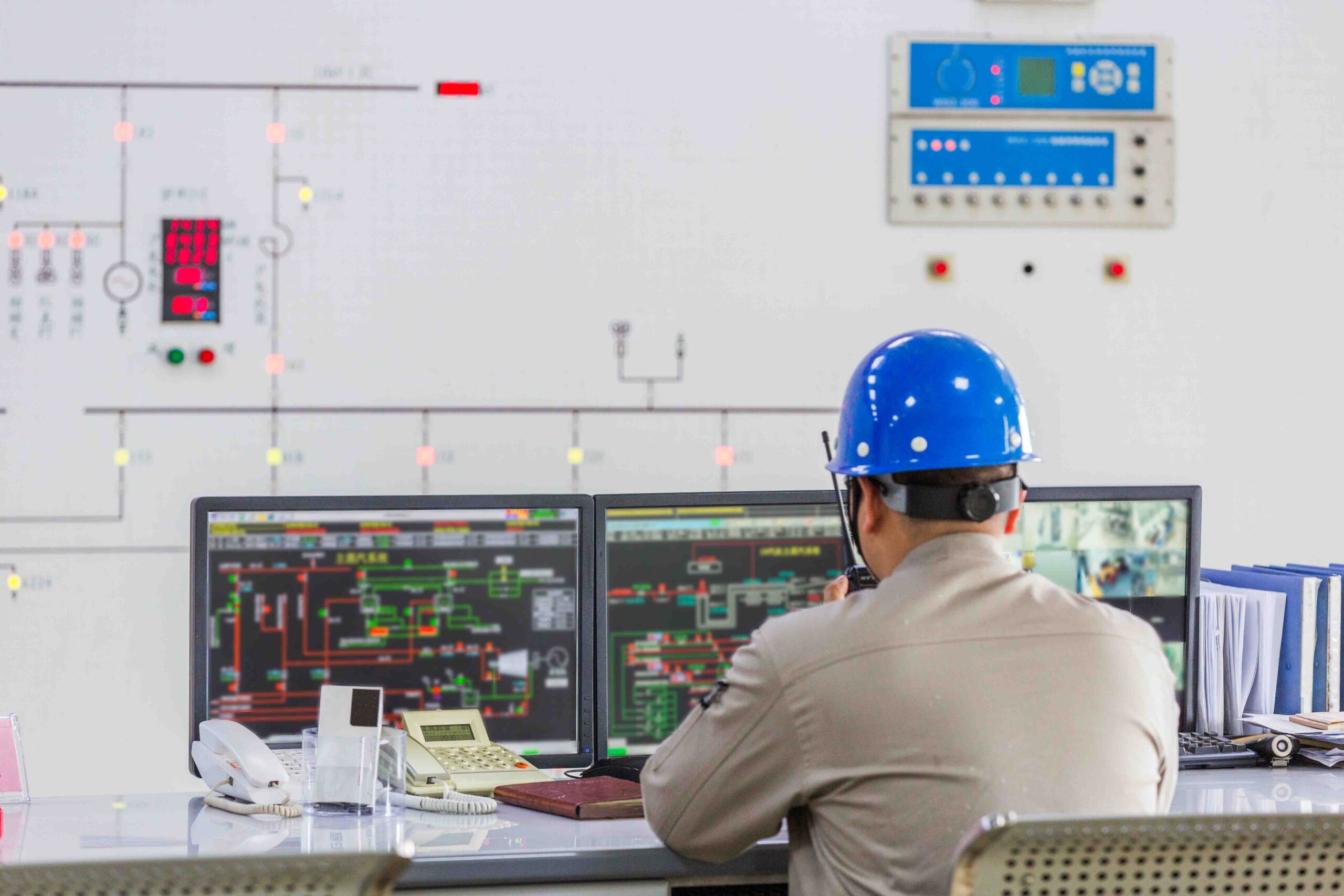 Close-up of professional electrical switchgear panels and protective relaying instruments inside a substation control room.