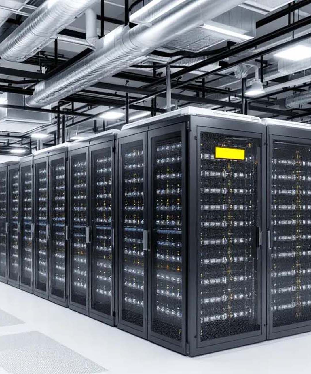 Rows of secure server racks and network equipment housed in a modern, climate-controlled enterprise data center.